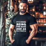 Man wearing a black t shirt that says "It's weird being the same age as old people."